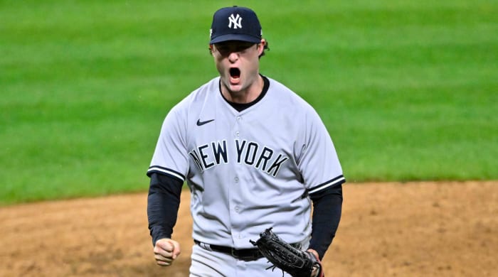 Yankees pitcher Gerrit Cole yells in celebration after finishing the seventh inning of Game 4 of the 2022 ALDS.